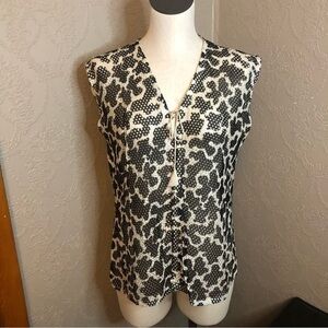 Vintage 70’s sheer vest with tassel tie cow print fabric is in great condition